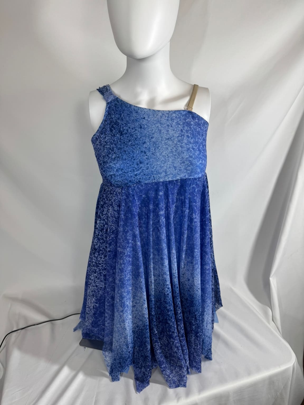 Front view of blue watercolor asymmetrical Revolution skating dress