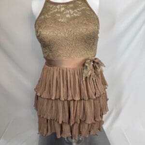 Front view of mocha lace and tiered chiffon Weismann skating dress with side accent