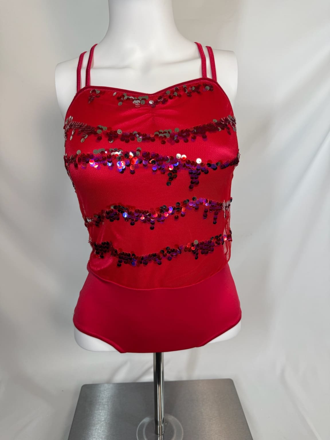 Front view of red sequin Weismann performance top with double straps
