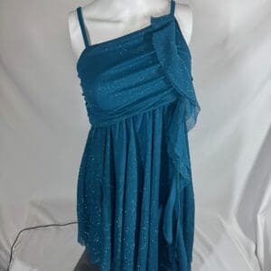 Front view of teal glitter Balera skating dress with asymmetrical draped bodice