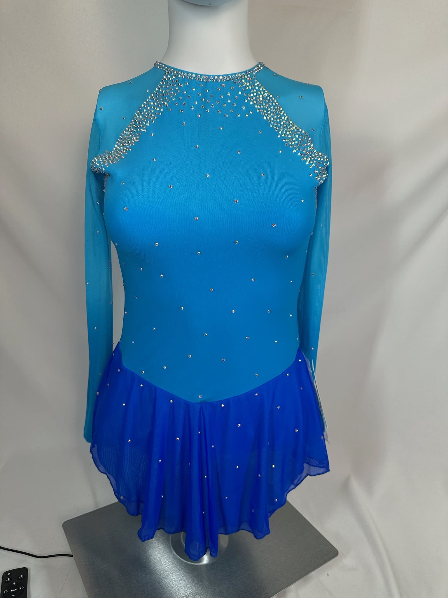 front view of Turquoise and Royal Blue Rhinestone Long Sleeve Figure Skating Dress