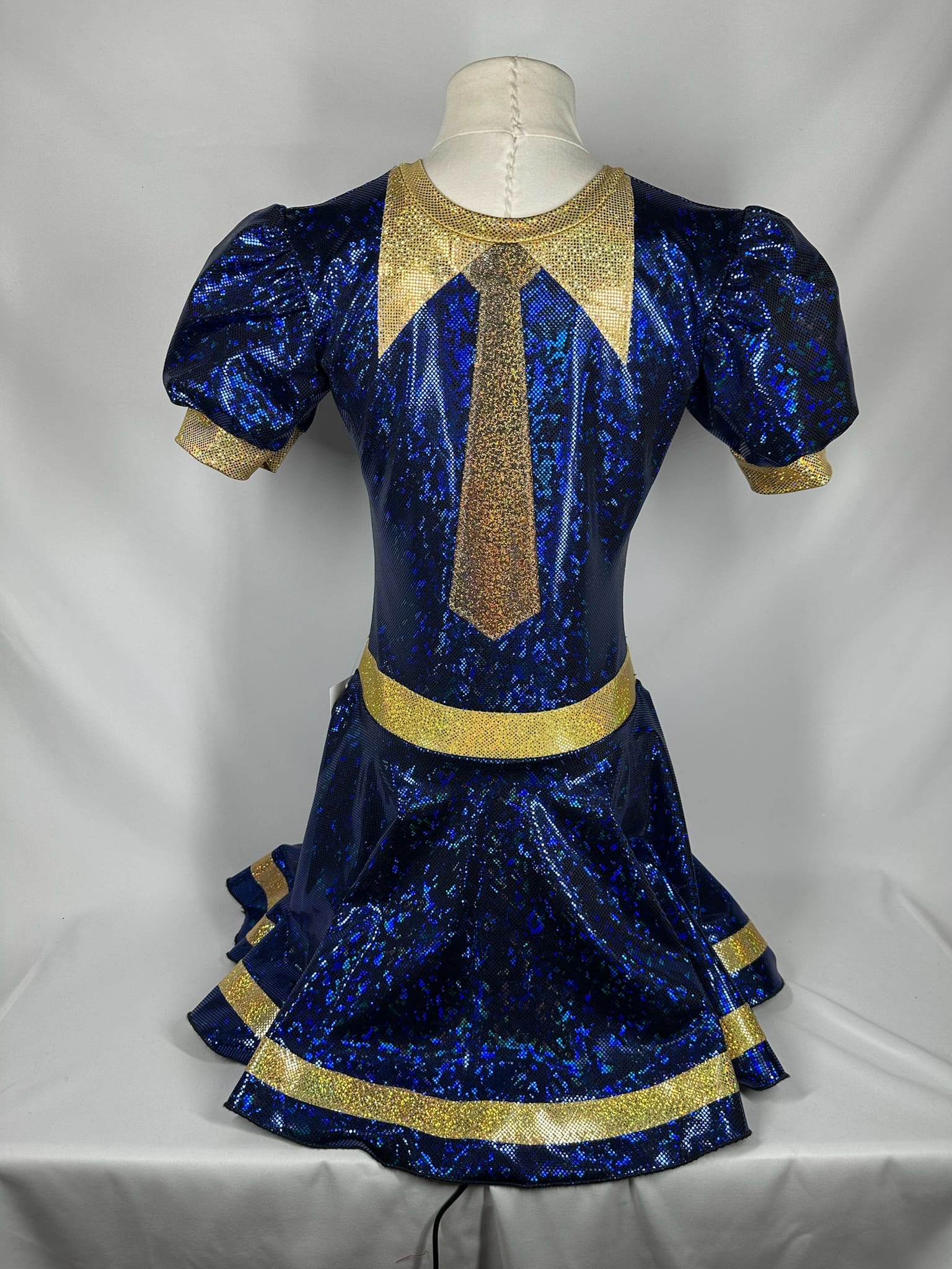 front view of Royal Blue Gold Uniform-Inspired Skating Dress