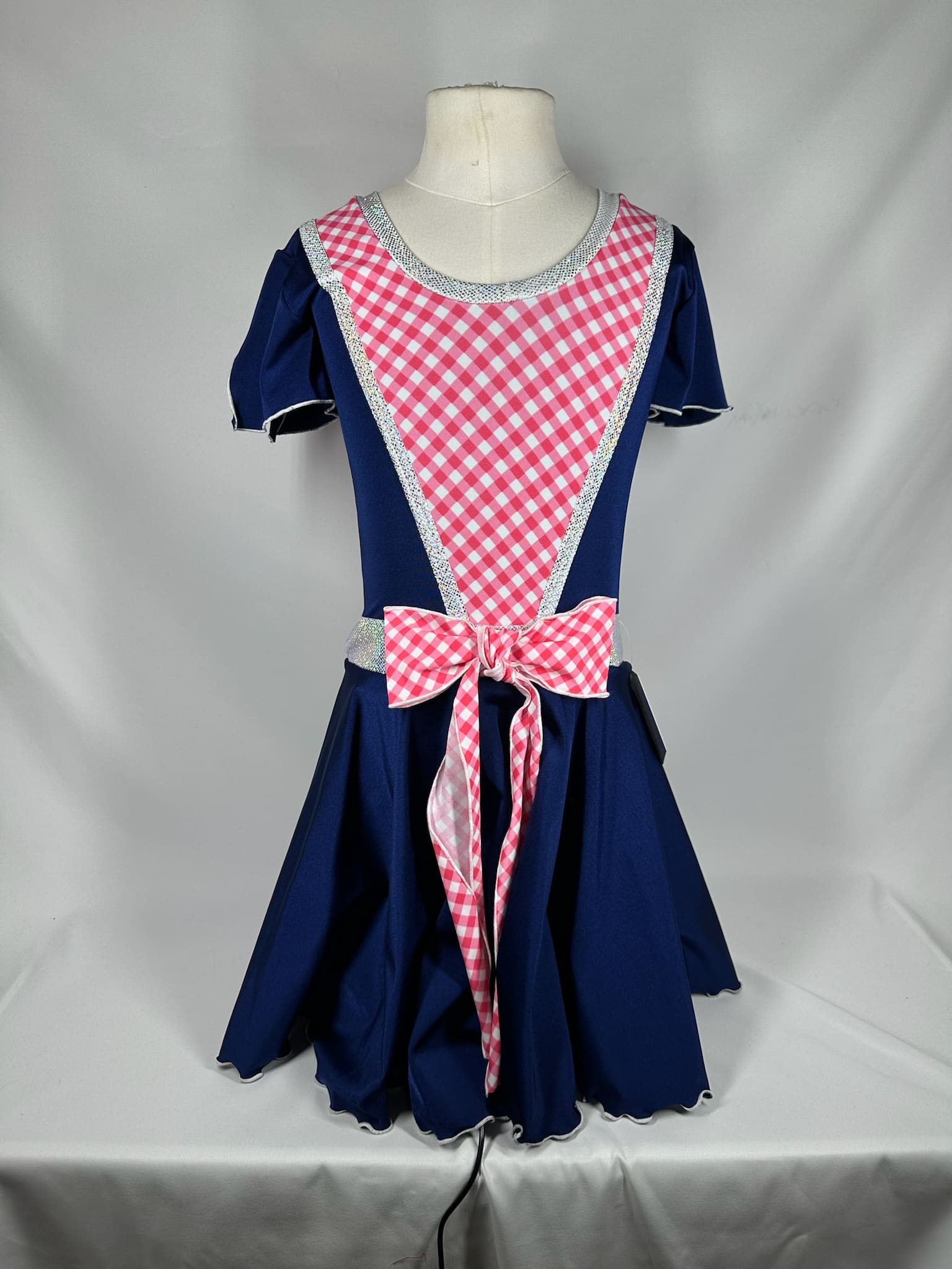front view of Country Gingham Navy Pink Bow Skating Dress