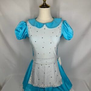 front view of Blue Storybook Apron Figure Skating Dress