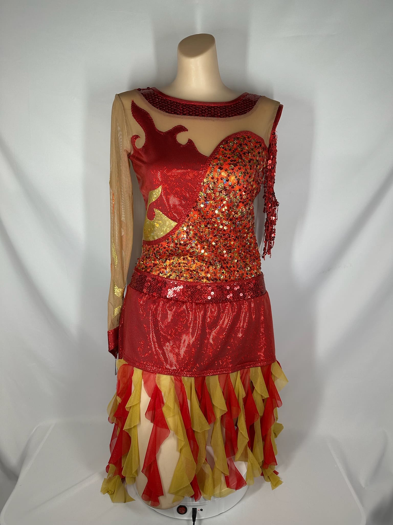 front view of Fiery Red Orange Gold Asymmetrical Figure Skating Dress