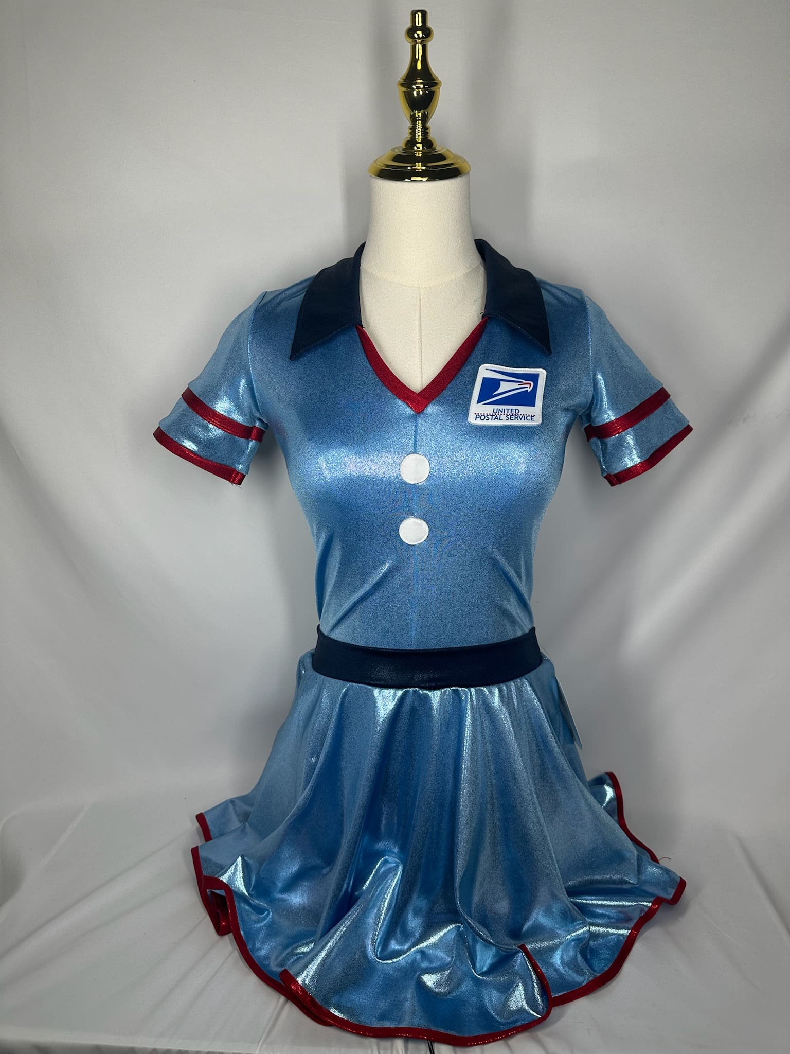 front view of Blue Metallic Postal Worker Themed Figure Skating Dress