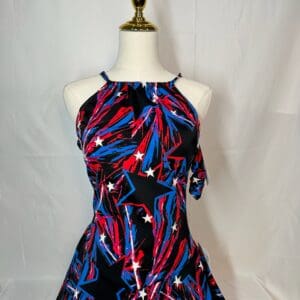 front view of Black Red and Blue Star Print Figure Skating Dress with Crisscross Back