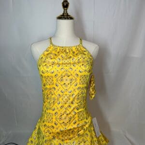 front view of Yellow Bandana Print Figure Skating Dress with Crisscross Straps