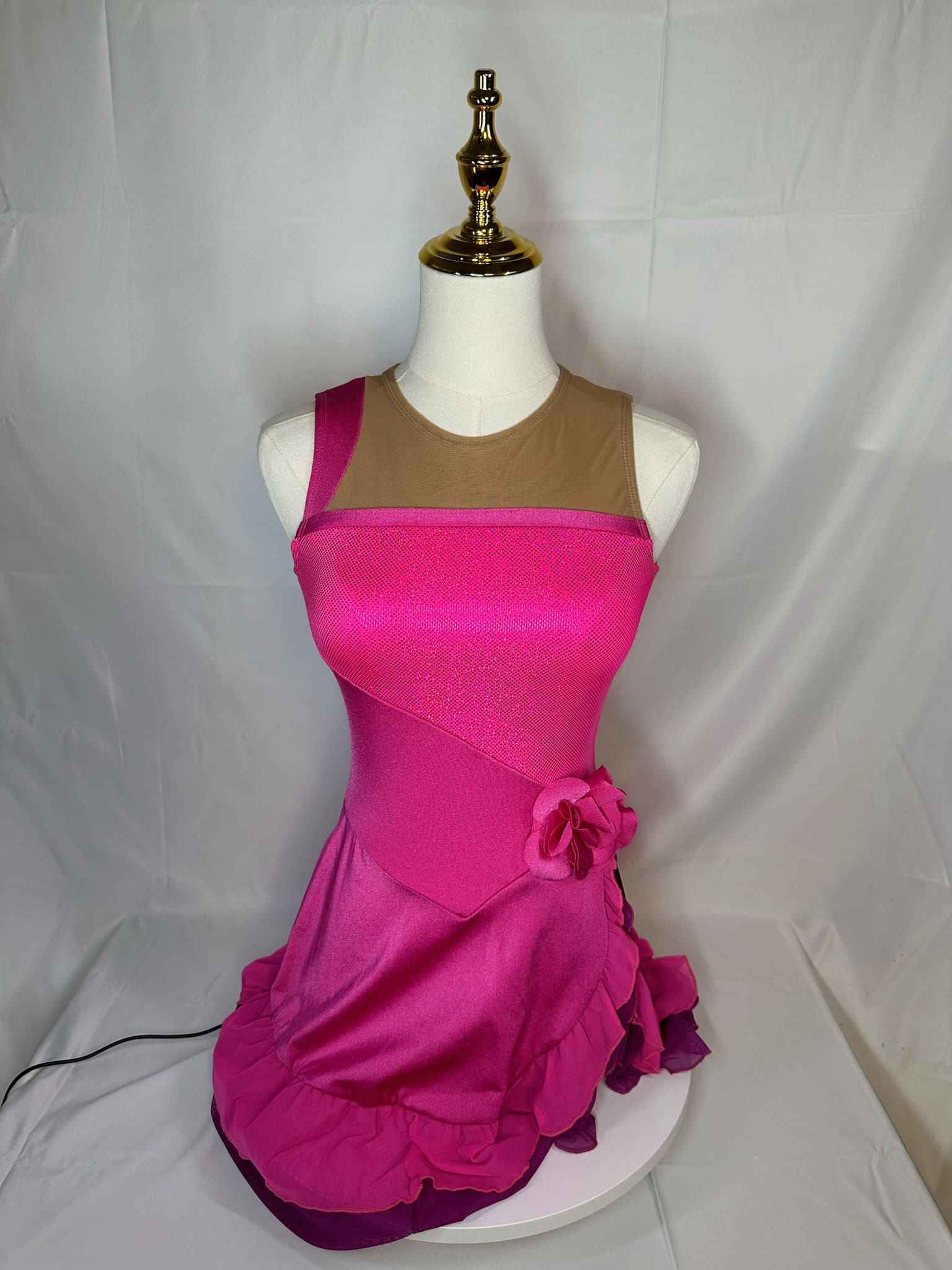 front view of Hot Pink Mesh Illusion Figure Skating Dress with Ruffle Skirt