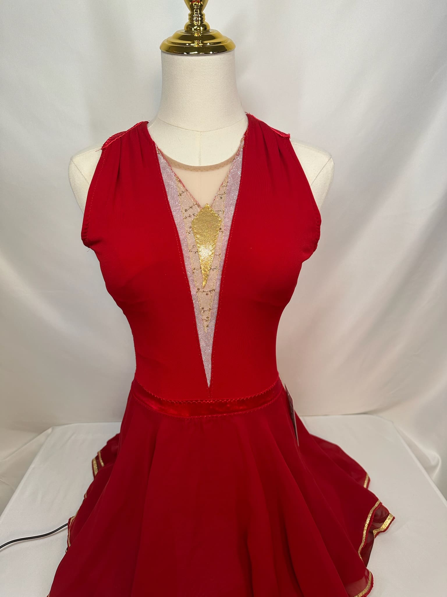 front view of Red Gold Accent Open Back Halter Skating Dress