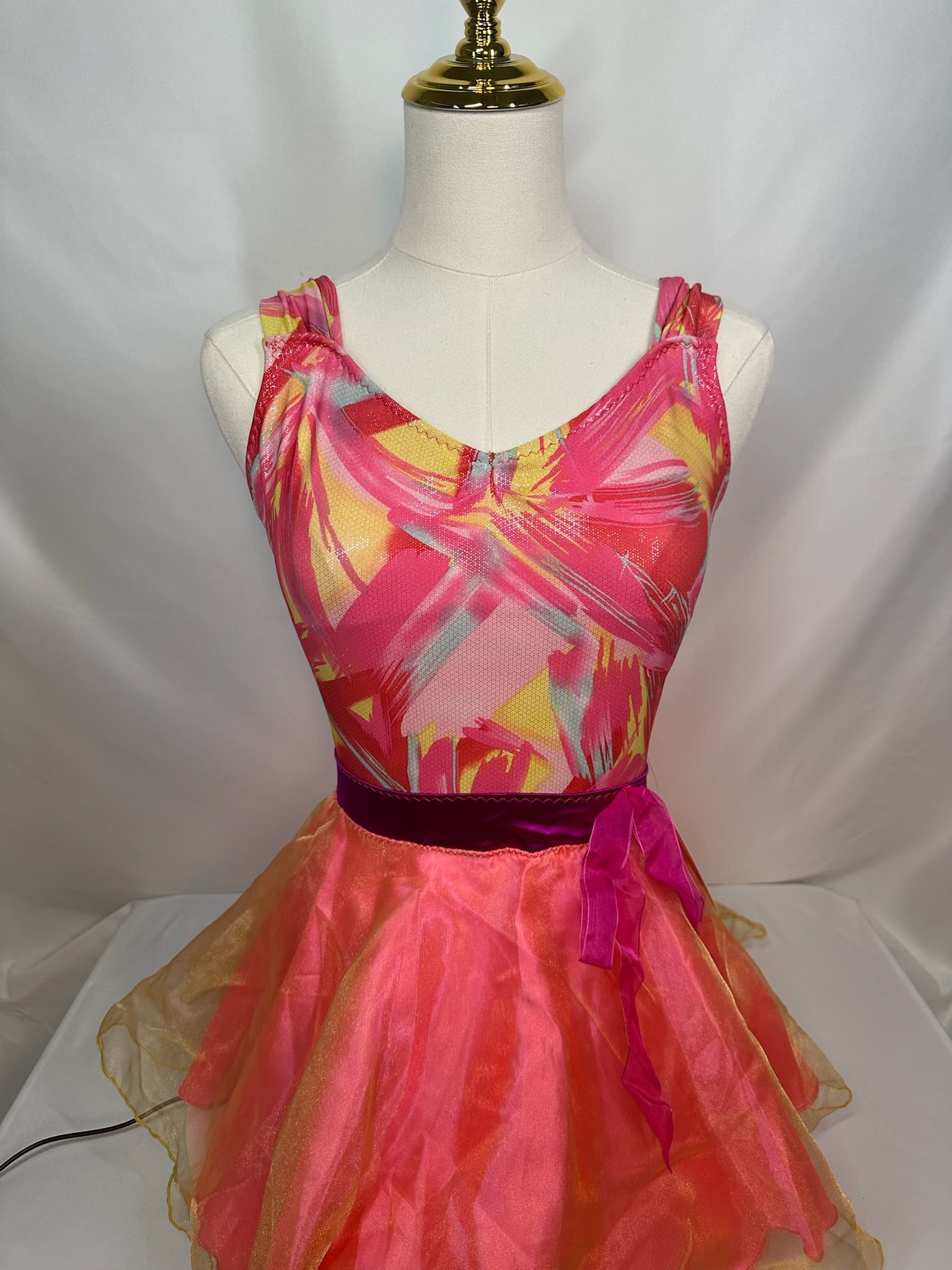 front view of Coral Abstract Print Layered Chiffon Skating Dress