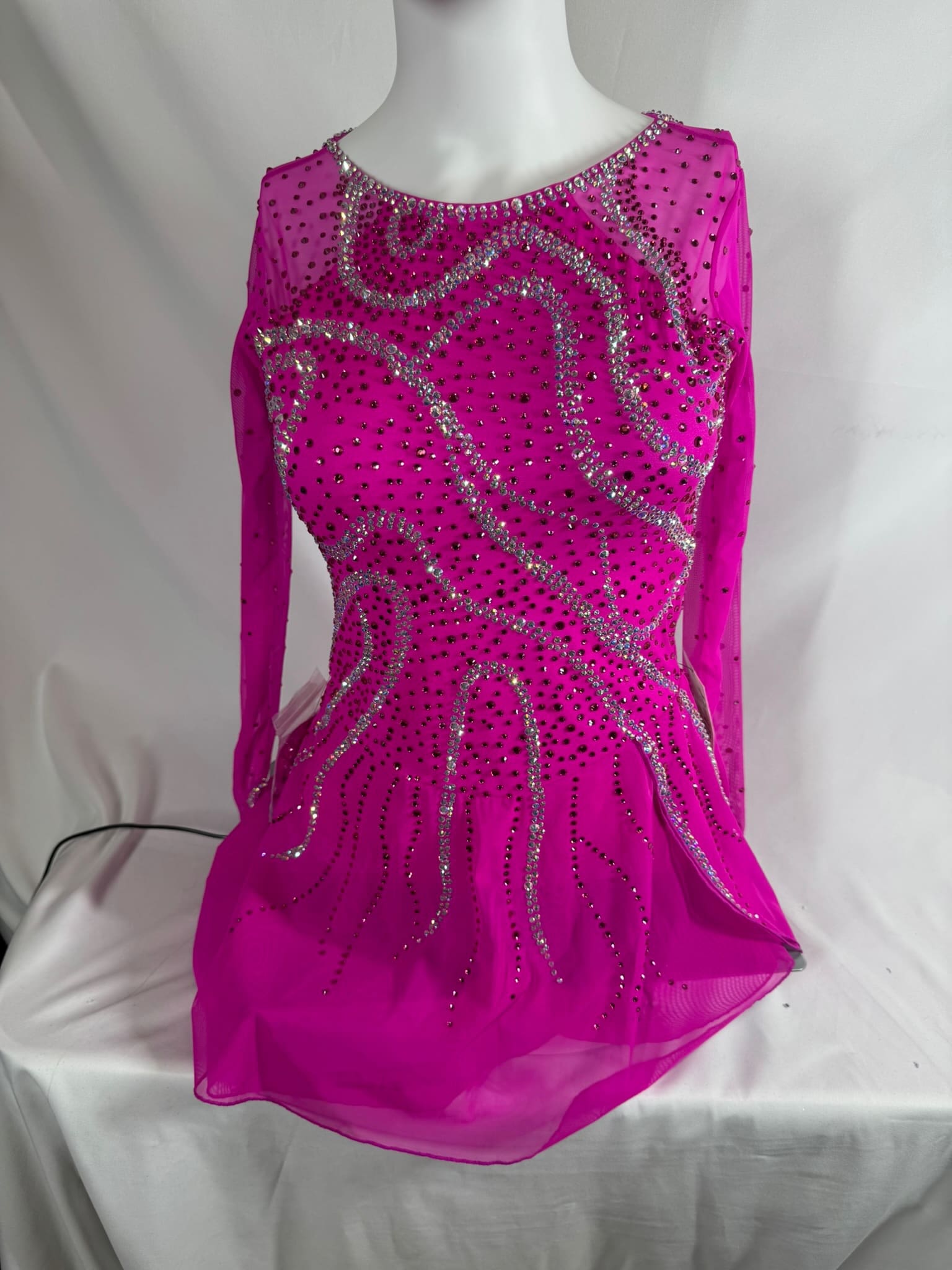 front view of Hot Pink Heavily Stoned Cross Back Figure Skating Dress