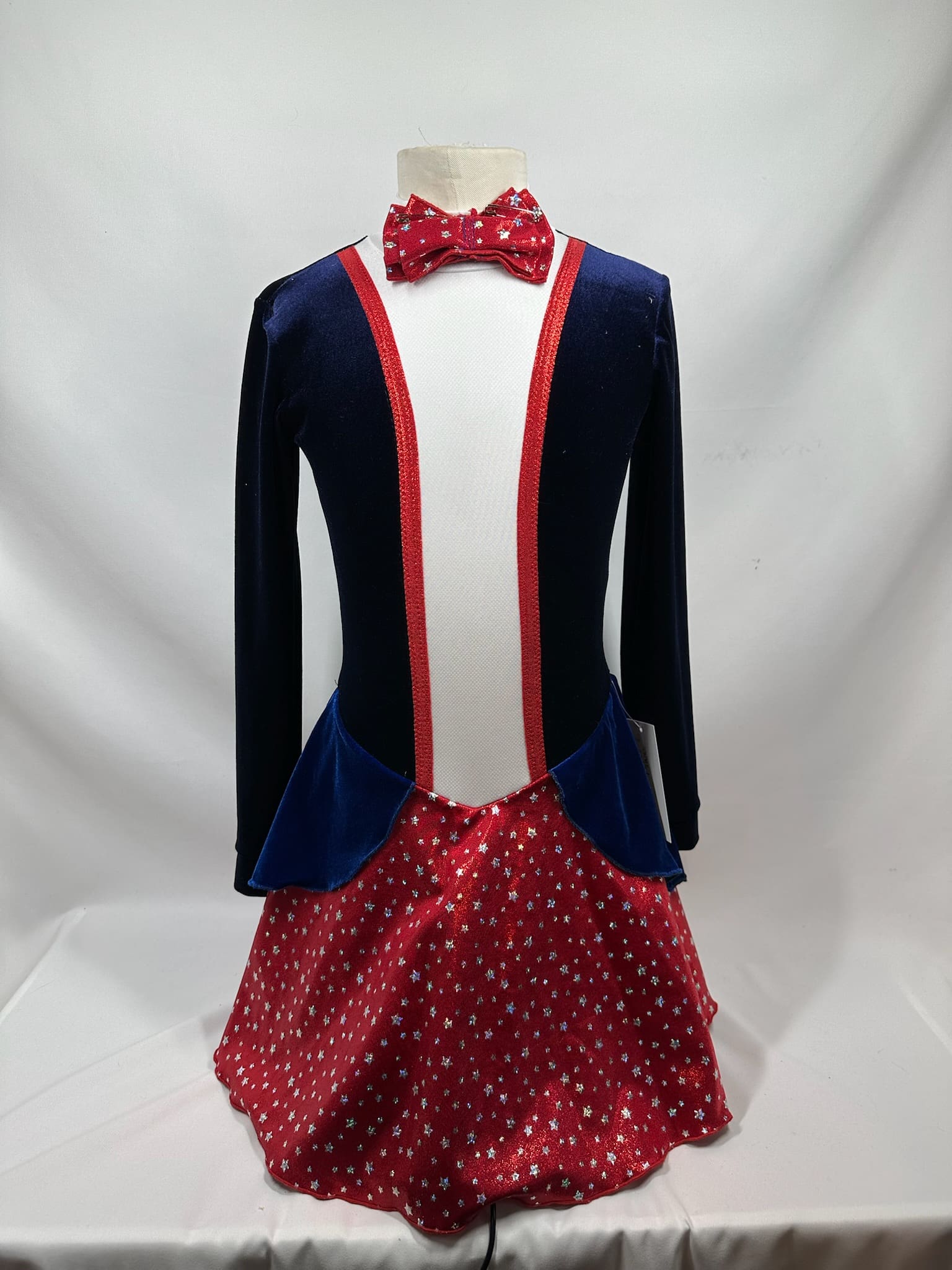 front view of Navy Red Star Bow Tie Patriotic Skating Dress