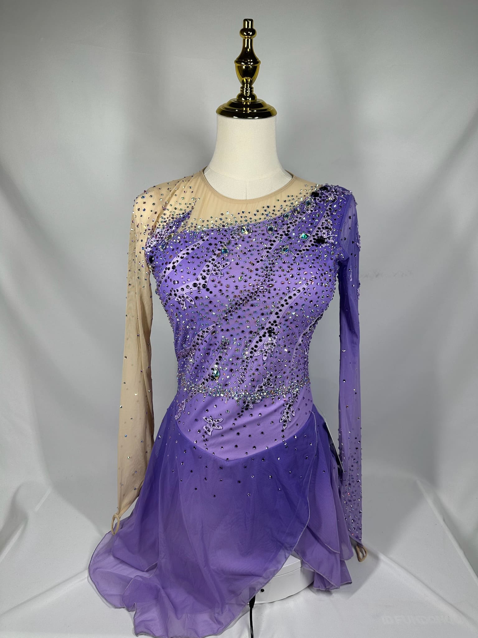 front view of Purple Asymmetrical Rhinestone Drape Figure Skating Dress