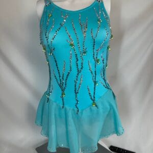 front view of Turquoise Swarovski Cross Back Figure Skating Dress